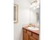 Bathroom vanity with cabinets and a large mirror at 4395 E Jewell Ave # 3, Denver, CO 80222