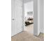 Neutral bedroom features plush carpet, with a cozy bed visible through a doorway at 4395 E Jewell Ave # 3, Denver, CO 80222
