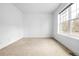 Bright bedroom with a large window providing natural light at 4395 E Jewell Ave # 3, Denver, CO 80222