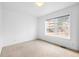 Bedroom featuring a large window overlooking outside at 4395 E Jewell Ave # 3, Denver, CO 80222