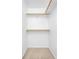 Walk-in closet with carpeted floor and built-in shelving for optimal storage and organization at 4395 E Jewell Ave # 3, Denver, CO 80222