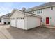 Two car garage with a red door at 4395 E Jewell Ave # 3, Denver, CO 80222