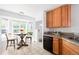Bright kitchen featuring a cozy breakfast nook with a bay window and table for casual dining at 4395 E Jewell Ave # 3, Denver, CO 80222