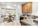 Charming kitchen with breakfast nook featuring a bay window and granite countertops at 4395 E Jewell Ave # 3, Denver, CO 80222