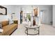 Stylish living room with modern decor and an open layout to the kitchen and dining area at 4395 E Jewell Ave # 3, Denver, CO 80222