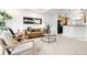 Bright living room features modern decor, stylish furnishings, and neutral tones at 4395 E Jewell Ave # 3, Denver, CO 80222