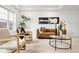 Bright living room features modern decor, stylish seating, and unique artwork at 4395 E Jewell Ave # 3, Denver, CO 80222