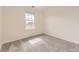 Bedroom with plush carpeting and window offering natural light at 3578 Tranquility Trl, Castle Rock, CO 80109