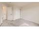 A bedroom is shown with neutral carpet and white trim, plus a closet with sliding doors and a doorway at 3578 Tranquility Trl, Castle Rock, CO 80109