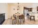 Comfortable dining area features a rustic table and stainless-steel appliances in the background at 3578 Tranquility Trl, Castle Rock, CO 80109
