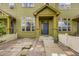 Charming home entrance with a blue front door and landscaped yard at 3578 Tranquility Trl, Castle Rock, CO 80109