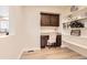 A dedicated office nook features built in desk, cabinets, and shelving at 3578 Tranquility Trl, Castle Rock, CO 80109