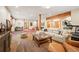 Spacious living area featuring polished concrete floors, wooden support beams, and neutral paint colors at 11652 Camp Eden Rd, Golden, CO 80403