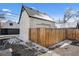 View of the house exterior and the privacy fence around the perimeter at 20 1/2 S Sherman St, Denver, CO 80209