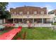 Exterior view of Lucille's Cafe with outdoor seating, picket fence, and charming architectural details at 20 1/2 S Sherman St, Denver, CO 80209