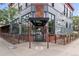 The AC restaurant and bar building in the city with lots of windows and signage at 20 1/2 S Sherman St, Denver, CO 80209