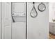 A laundry room area featuring a stacked washer and dryer in a bright, modern space at 20 1/2 S Sherman St, Denver, CO 80209