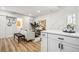 Bright living space and stairs, complemented by luxury vinyl plank flooring at 20 1/2 S Sherman St, Denver, CO 80209