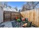 Back patio with outdoor seating and wooden privacy fence, perfect for relaxing at 20 1/2 S Sherman St, Denver, CO 80209