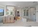 Modern bathroom with a double shower, wooden vanity, and a view into the living room at 4125 Aspen Ln, Evergreen, CO 80439