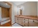 Rustic bathroom featuring tile flooring, bathtub-shower combo with updated vanity and sink at 4125 Aspen Ln, Evergreen, CO 80439