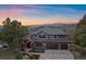 Stunning home with stone accents, three-car garage and mountain views in the background at 4125 Aspen Ln, Evergreen, CO 80439