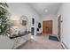 Welcoming foyer with stylish decor, tile flooring, and wood accent doors at 4125 Aspen Ln, Evergreen, CO 80439