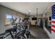 Home gym featuring exercise equipment, a TV, and large windows with a mountain view at 4125 Aspen Ln, Evergreen, CO 80439