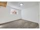 Cozy basement featuring carpeting, a small window, and white walls at 5771 W 92Nd Ave # 335, Westminster, CO 80031