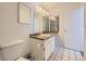 Bright bathroom featuring a vanity with a marble countertop and a large mirror at 5771 W 92Nd Ave # 335, Westminster, CO 80031