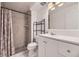 Bathroom features a shower with tile surround, white vanity and countertop, plus updated fixtures at 5771 W 92Nd Ave # 335, Westminster, CO 80031