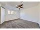 Comfortable bedroom featuring neutral carpet, a ceiling fan, and a window at 5771 W 92Nd Ave # 335, Westminster, CO 80031