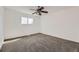 Neutral bedroom featuring plush carpeting, a ceiling fan, and a bright window at 5771 W 92Nd Ave # 335, Westminster, CO 80031