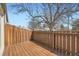 Private wooden deck with wood railing provides an enjoyable outdoor space at 5771 W 92Nd Ave # 335, Westminster, CO 80031