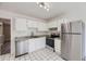 Modern kitchen with stainless steel appliances, white cabinets, and granite countertops at 5771 W 92Nd Ave # 335, Westminster, CO 80031