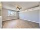 Bright living room featuring stylish wood floors, decorative ceiling trim, and large window at 5771 W 92Nd Ave # 335, Westminster, CO 80031