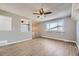 Open living room featuring stylish wood floors, and large windows with natural lighting at 5771 W 92Nd Ave # 335, Westminster, CO 80031