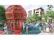 Neighborhood park featuring unique orange jungle gym and a playground at 5771 W 92Nd Ave # 335, Westminster, CO 80031