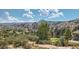 Scenic view of the rolling hills and golf course surrounded by trees and rock formations at 8959 Yellowcress St, Littleton, CO 80125