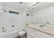Bathroom with a bathtub and shower combination and a vanity with a large mirror at 2013 S Helena St # B, Aurora, CO 80013