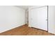 This bedroom features sliding door closet, wood flooring, and neutral paint at 2013 S Helena St # B, Aurora, CO 80013