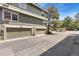 Exterior view of townhome garages and parking with nearby landscaping at 2013 S Helena St # B, Aurora, CO 80013