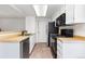Efficient kitchen features ample countertop space, modern appliances, and a neutral color scheme at 2013 S Helena St # B, Aurora, CO 80013