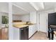 Functional kitchen with wood countertops, stainless steel appliances, and white cabinetry at 2013 S Helena St # B, Aurora, CO 80013