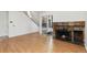 Living room with a staircase, stone fireplace, and sliding glass doors to the exterior at 2013 S Helena St # B, Aurora, CO 80013