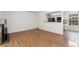 Spacious living room featuring hardwood floors, a fireplace, and an open floor plan at 2013 S Helena St # B, Aurora, CO 80013
