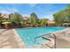Exterior shot of the community pool with lounge chairs and green landscaping at 2013 S Helena St # B, Aurora, CO 80013