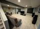 Finished basement with neutral carpet, movie posters, and seating provides extra living space at 5506 Malta St, Denver, CO 80249