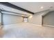 Open and spacious basement area with neutral walls and carpet at 5506 Malta St, Denver, CO 80249
