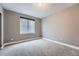 Neutral bedroom with window and plush carpet creates a comfortable and inviting space at 5506 Malta St, Denver, CO 80249